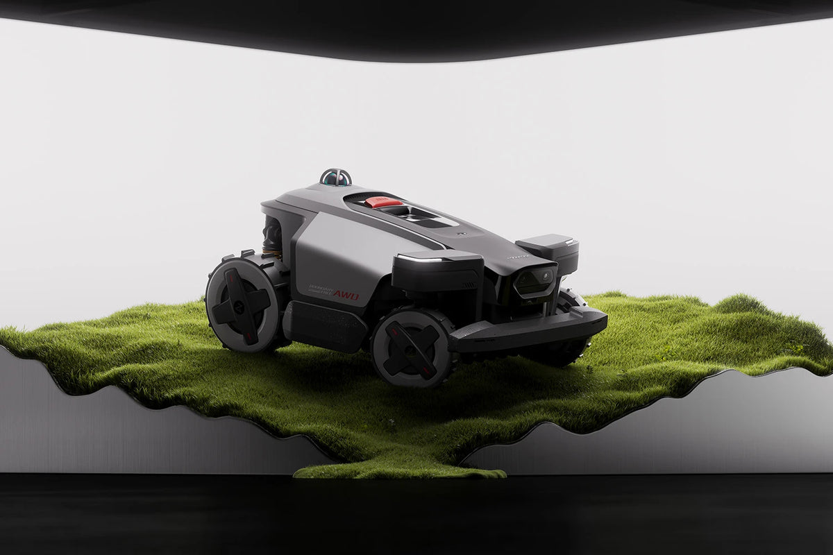 RockMow Z1 LiDAR robotic lawn mower showing four-wheel drive terrain handling on uneven grass