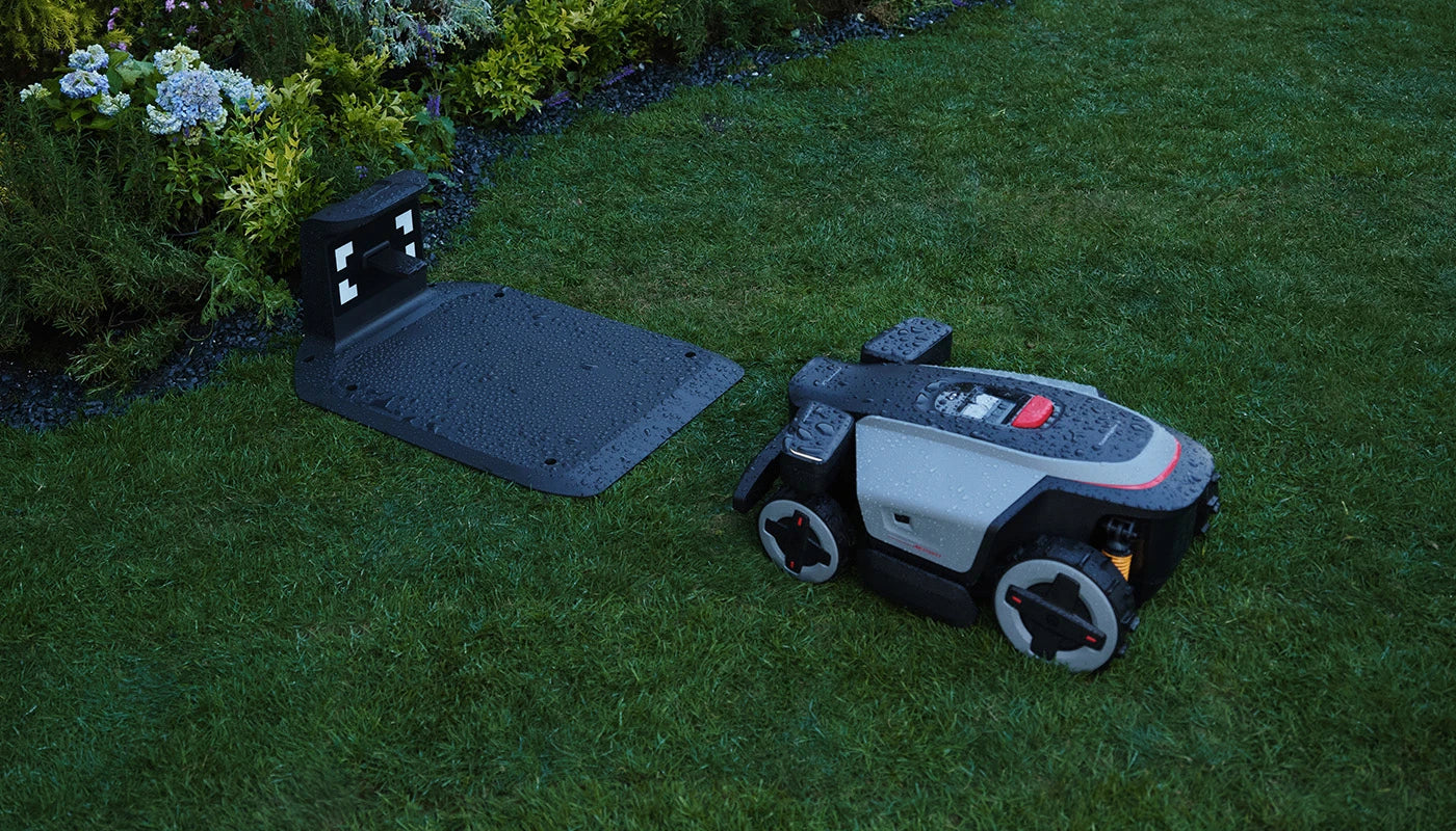 RockMow Z1 robotic lawn mower detecting wet weather and returning to its charging station using rain sensing.