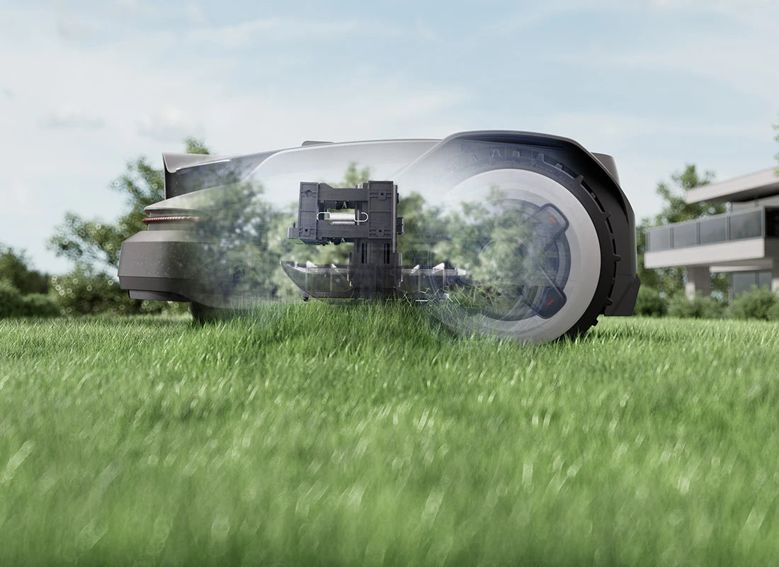 RockNeo Q1 robotic lawn mower using its floating cutting deck on uneven grass