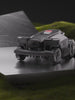 RockMow Z1 robotic lawn mower in a studio setting on a grass bank.